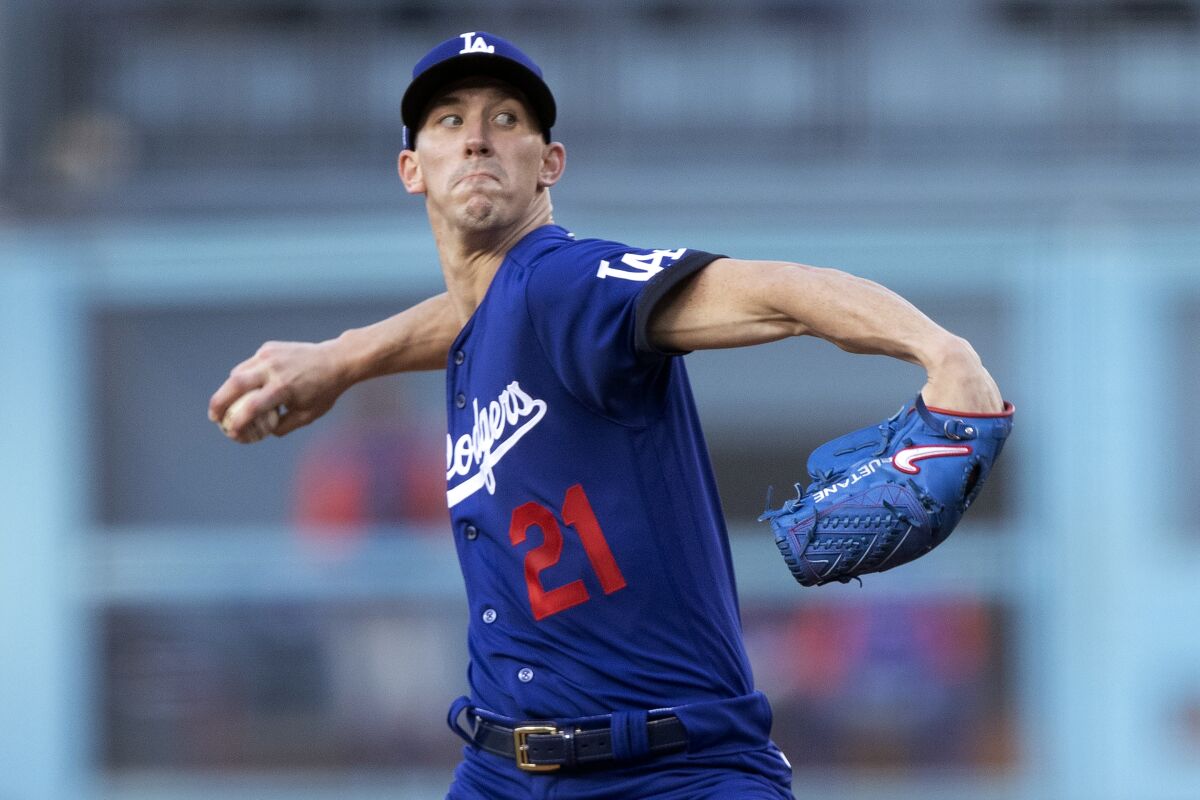 Dodgers pitcher Walker Buehler delivers against the Mets in June.