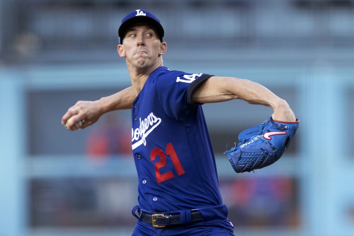 Los Angeles Dodgers starting pitcher Walker Buehler throws the ball.