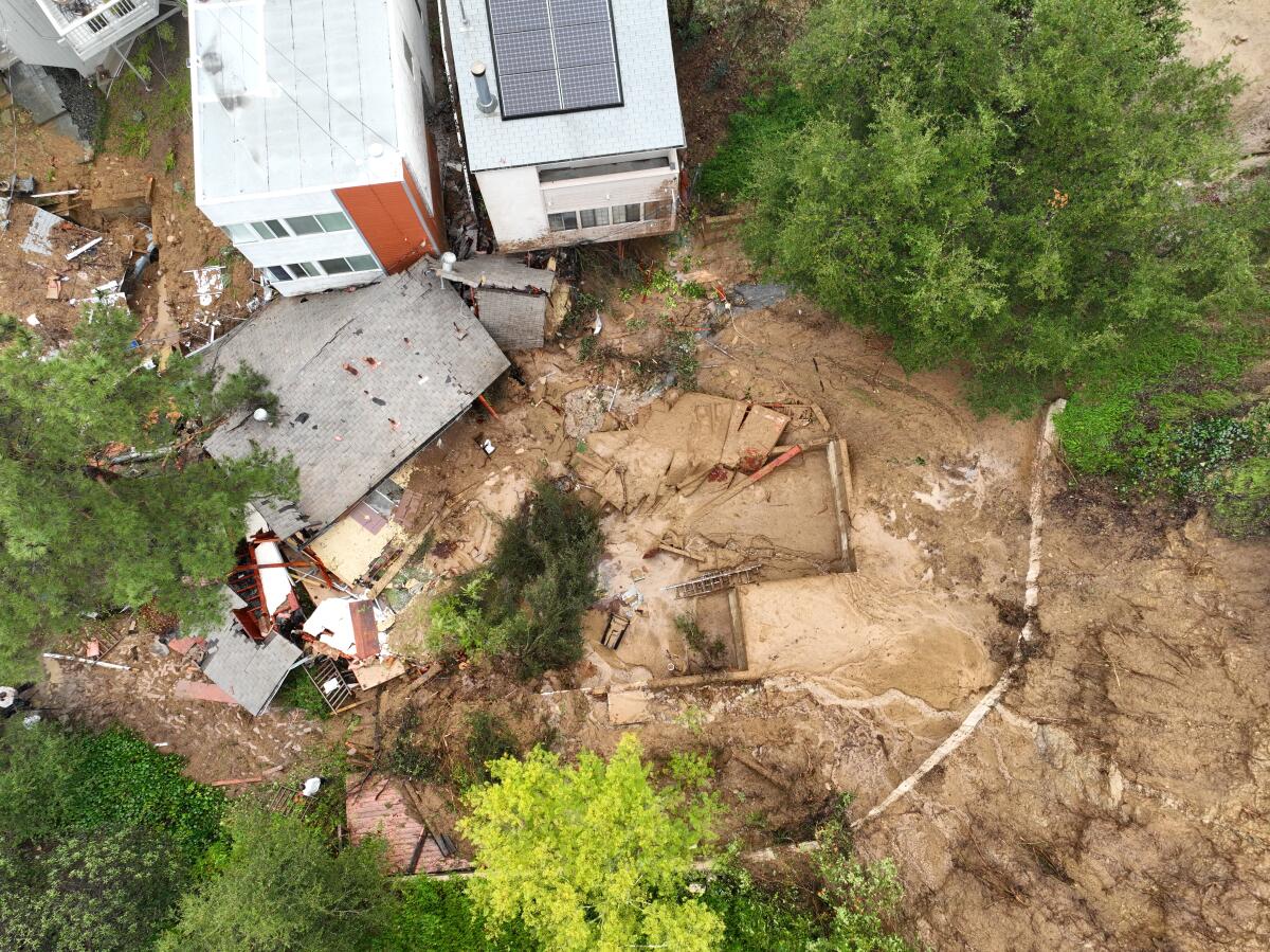 An aerial view of a home that was pushed off its foundation by a mudslide.
