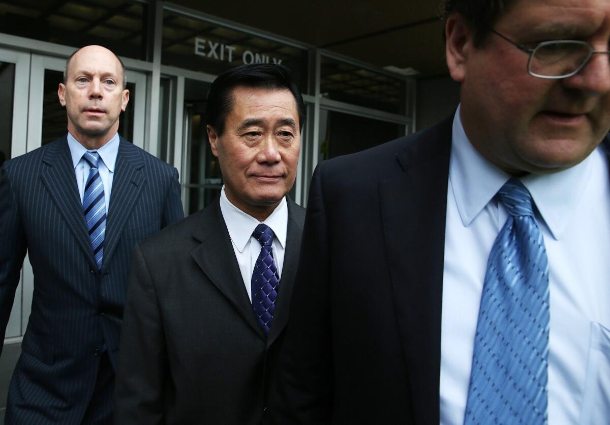 State Sen. Leland Yee, center, leaves the Phillip Burton Federal Building with his attorneys after a court appearance in San Francisco.