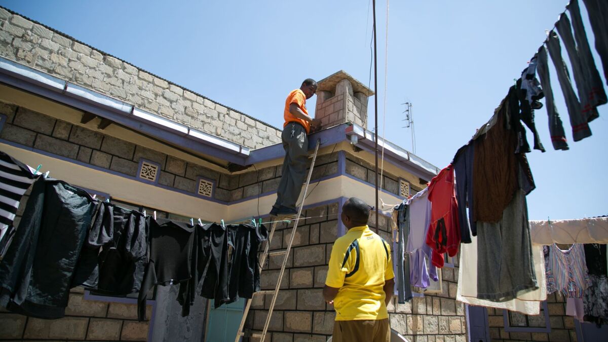 A StarTimes satellite dish is installed on Francis Gitonga's roof in Kajiado, Kenya. Gitonga said the new digital TV package, with Chinese and Kenyan programs, gave him better reception than he’d once thought possible in the town.