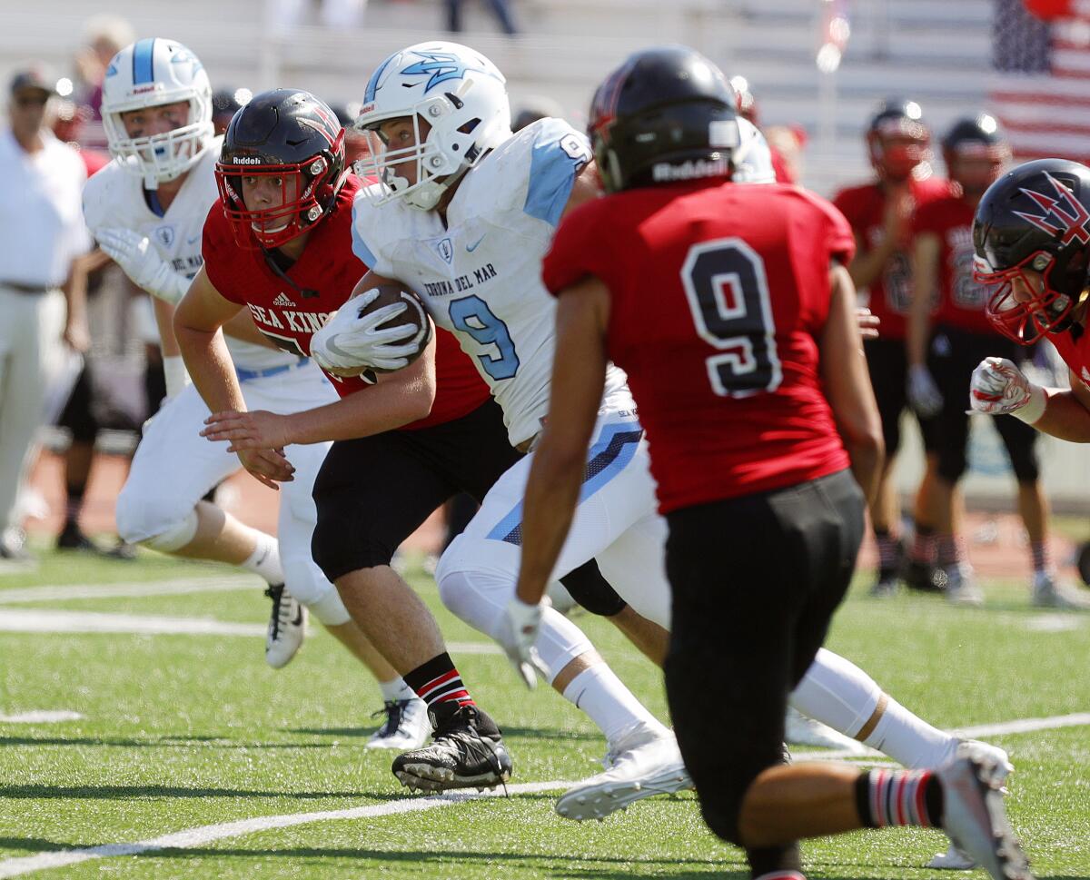 Corona del Mar's Carter Duss looks for running room against Palos Verdes during a nonleague game Sept. 6.