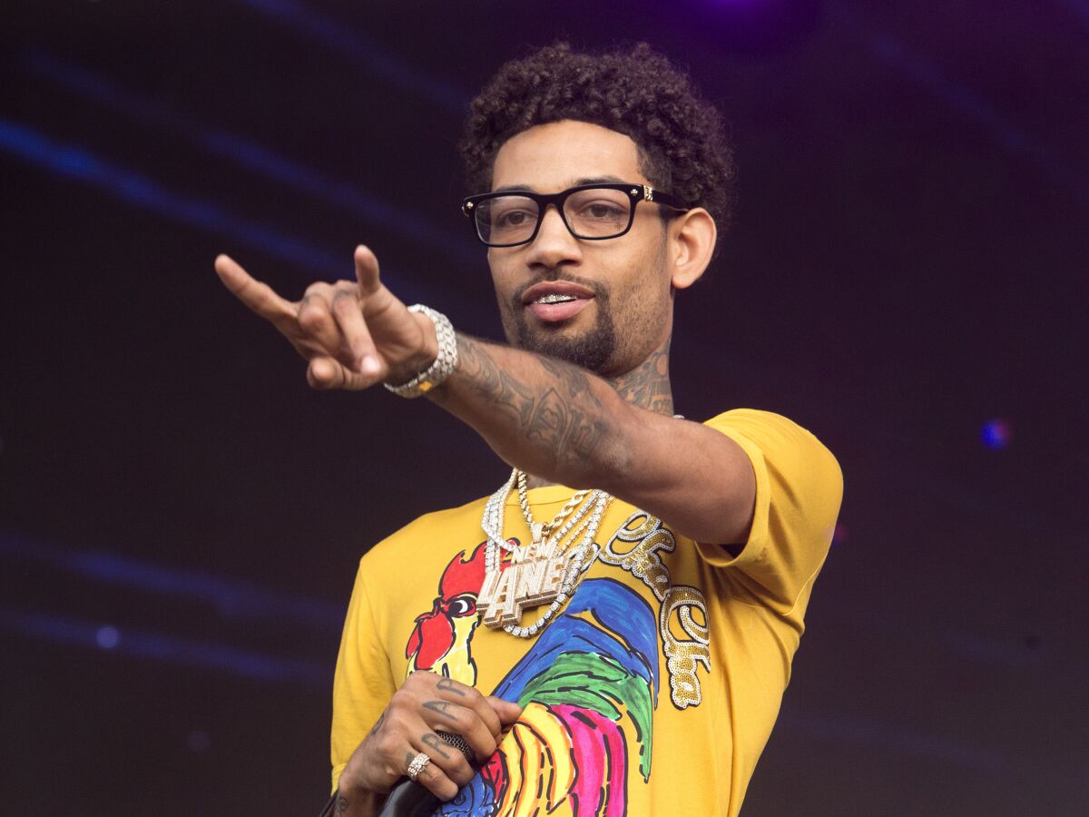 FILE - Philadelphia rapper PnB Rock performs at the 2018 Firefly Music Festival in Dover, Del., on June 16, 2018. The rapper, whose real name is Rakim Allen, was fatally shot during a robbery in South Los Angeles on Monday, Sept. 12, 2022. He is best known for his 2016 hit “Selfish.” He released his latest song, “Luv Me Again,” on Sept. 2. (Photo by Owen Sweeney/Invision/AP, File)