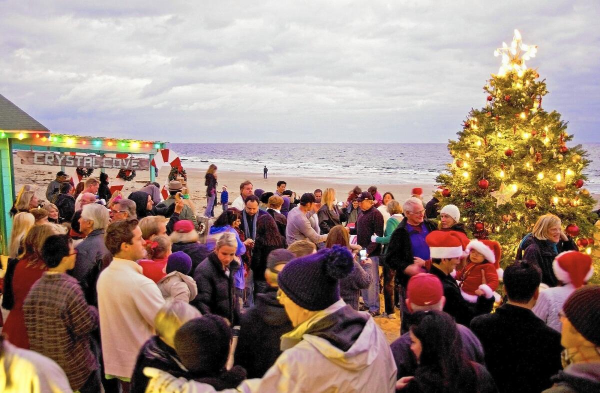 People gather at a previous Crystal Cove Tree Lighting ceremony.