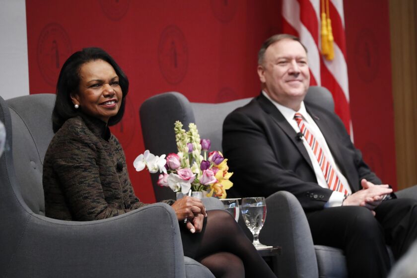Former Secretary of State Condoleezza Rice, left, and Secretary of State Mike Pompeo listen to a question during an event hosted by the Hoover Institution at Stanford University in Stanford, Calif., Monday, Jan. 13, 2020. (John G. Mabanglo/Pool Photo via AP)