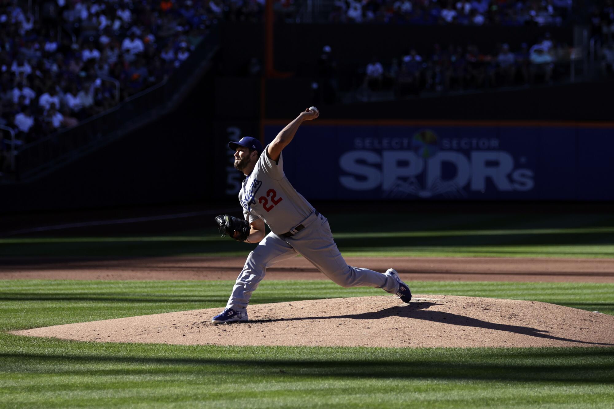 Los Angeles Dodgers pitcher Clayton Kershaw throws during the first inning of a baseball game.