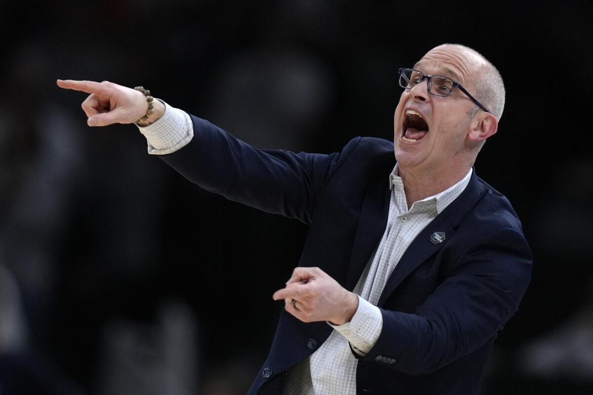 UConn coach Dan Hurley calls out to his players during an Elite 8 game against Illinois on March 30.