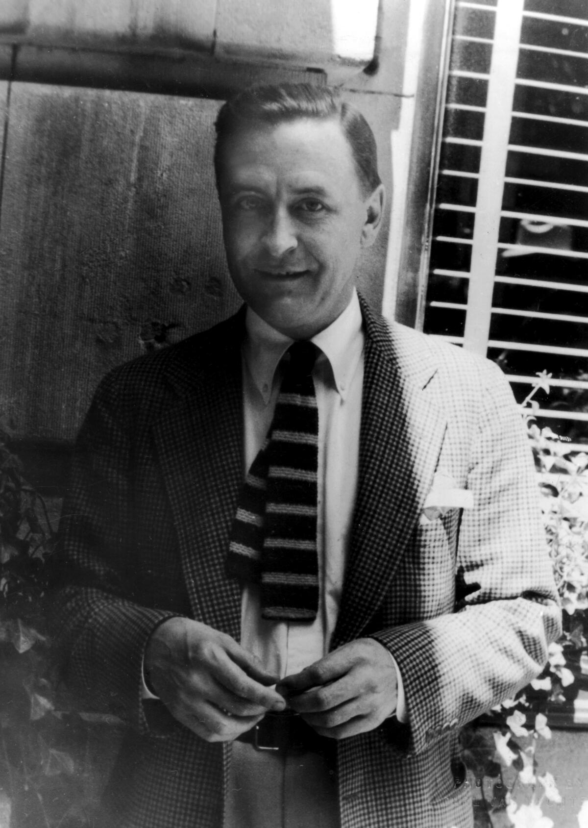 A black-and-white portrait of author F. Scott Fitzgerald in 1937, wearing a jacket and tie.