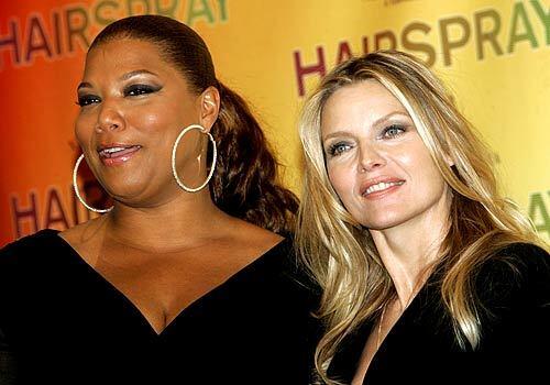 Actresses Queen Latifah and Michelle Pfeiffer promote their film "Hairspray" during ShoWest.