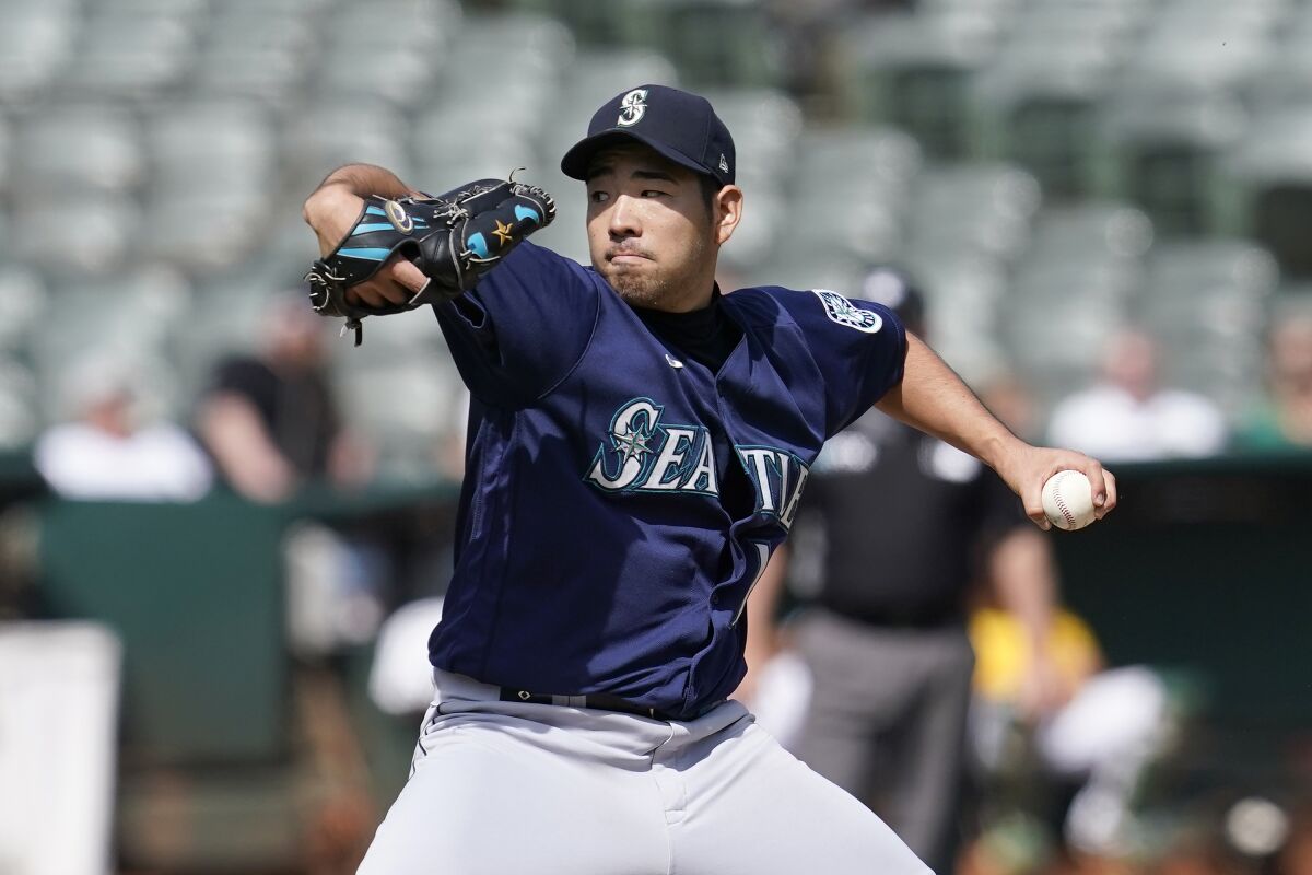 FILE - Seattle Mariners' Yusei Kikuchi pitches against the Oakland Athletics during the second inning of a baseball game in Oakland, Calif., Thursday, Sept. 23, 2021. eft-handed pitcher Yusei Kikuchi is leaving the Seattle Mariners after the team declined a club option on the All-Star and Kikuchi opted for free agency. The Mariners announced the decision with Kikuchi on Wednesday, Nov. 3, 2021.(AP Photo/Jeff Chiu, File)