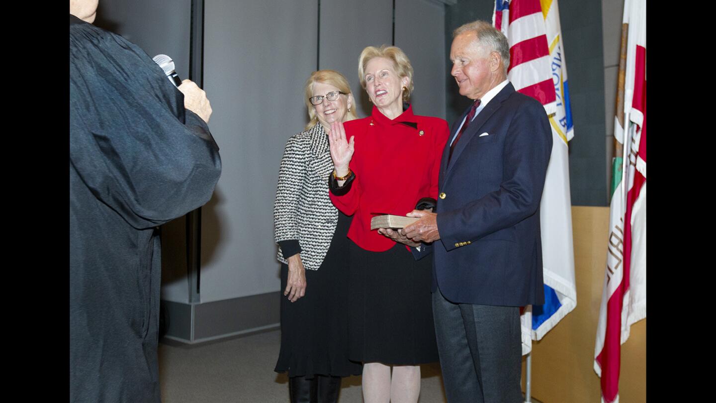 Diane Dixon takes the oath of office Tuesday during her swearing-in for a second term as the District 1 representative on the Newport Beach City Council. The council also selected her to be mayor for the next year.