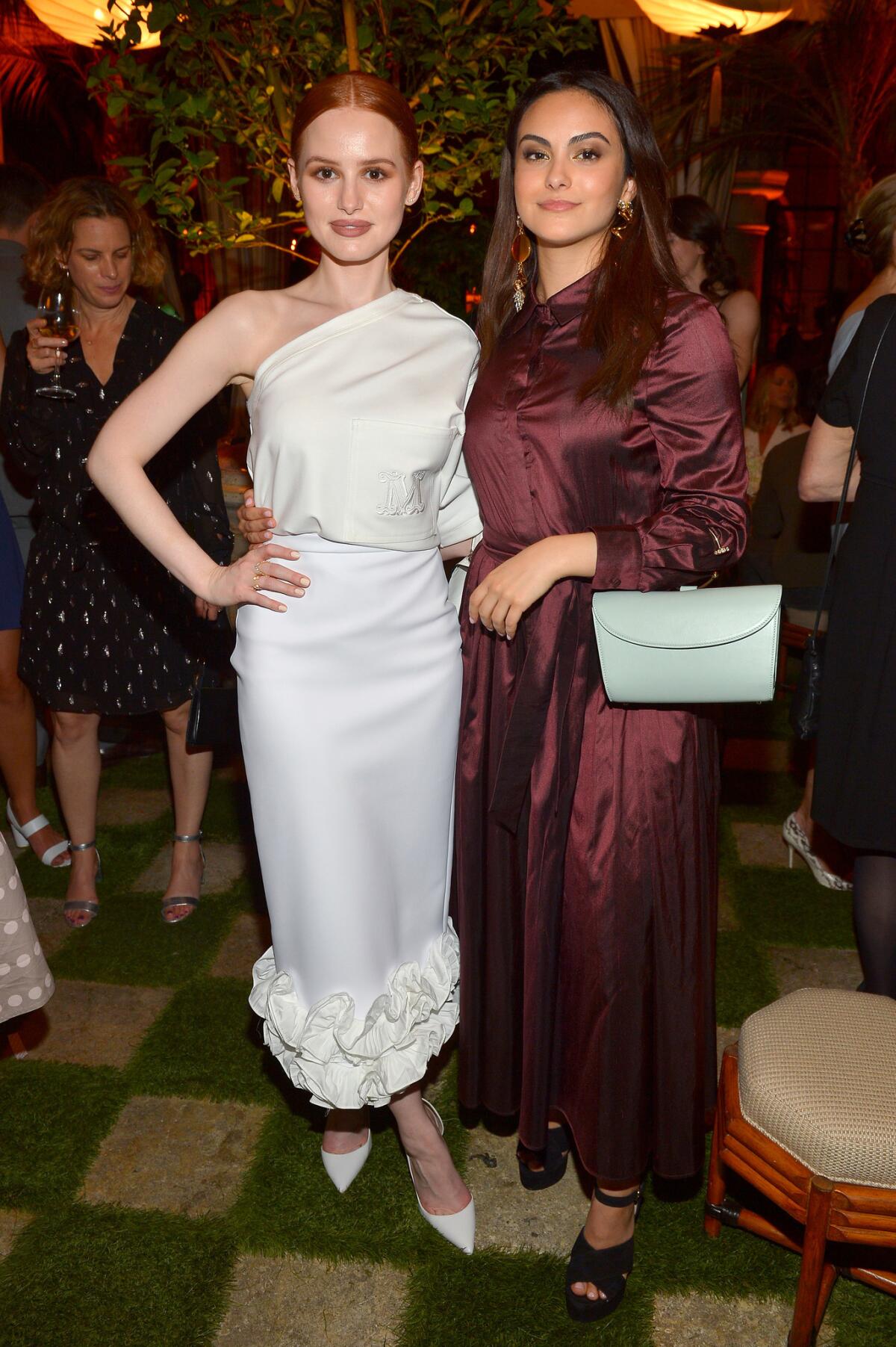 Madelaine Petsch,left, and Camila Mendes, both in Max Mara, attend the Women in Film Max Mara Face of the Future cocktail party celebrating honoree Elizabeth Debicki.