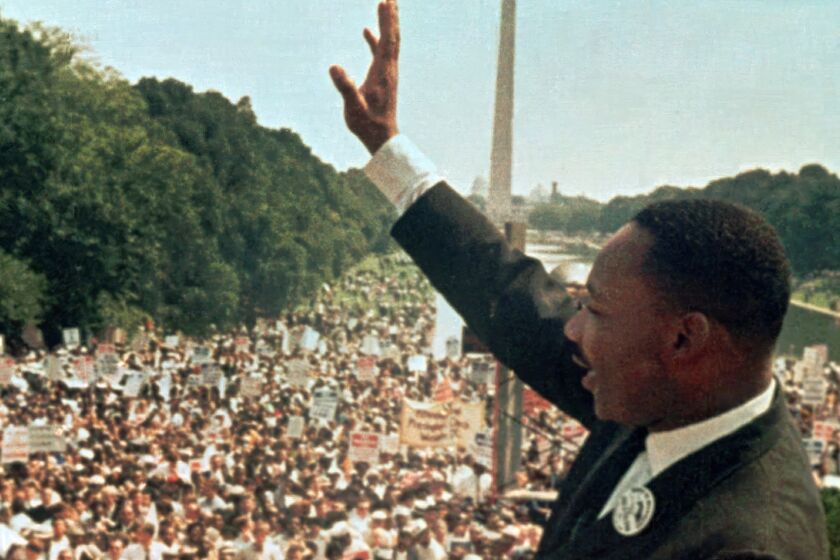 FILE - Martin Luther King Jr. acknowledges the crowd at the Lincoln Memorial for his "I Have a Dream" speech during the March on Washington on Aug. 28, 1963. As the country awaits a Supreme Court decision on whether one of those laws, the Voting Rights Act, will be reinforced or further eroded, a small, vanishing group who lived at the epicenter of the struggle for voting rights six decades ago is reflecting on the times and their struggles, and why it was worth it. (AP Photo/File)