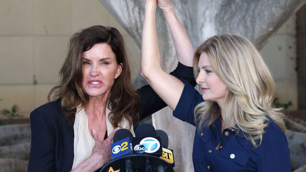 Janice Dickinson (L) and attorney Lisa Bloom speak about her lawsuit against Bill Cosby in 2016 in Los Angeles,