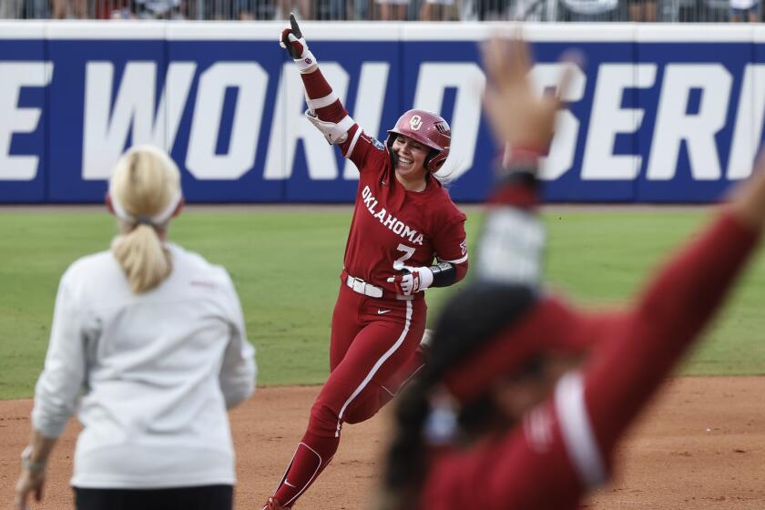 Oklahoma's Kasidi Pickering (7) celebrates a home run against Texas during the second inning.