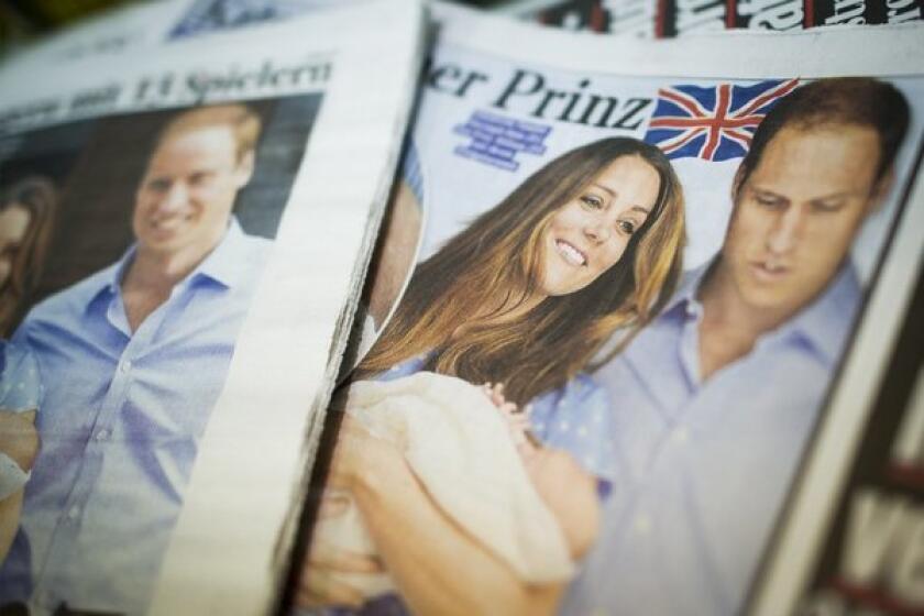 German newspapers feature photographs of Prince William and his wife Catherine with their newborn son.