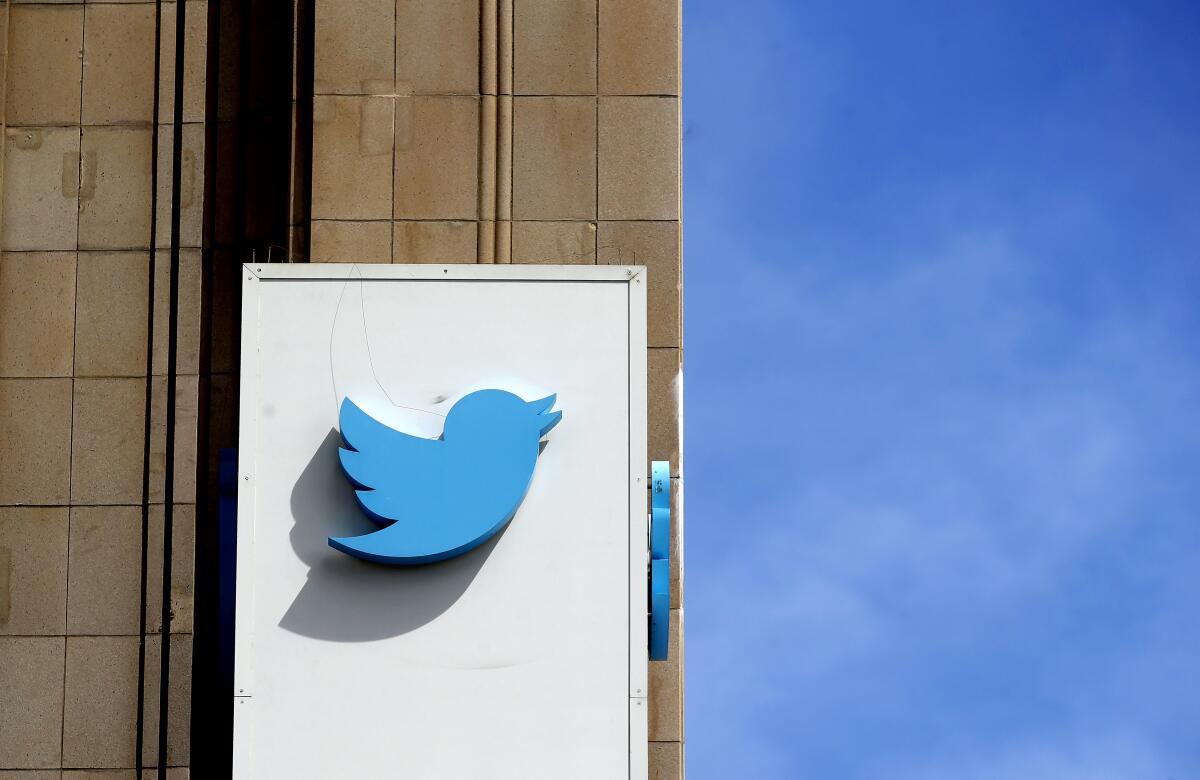 Twittter's logo is on a sign outside its office building in San Francisco. 