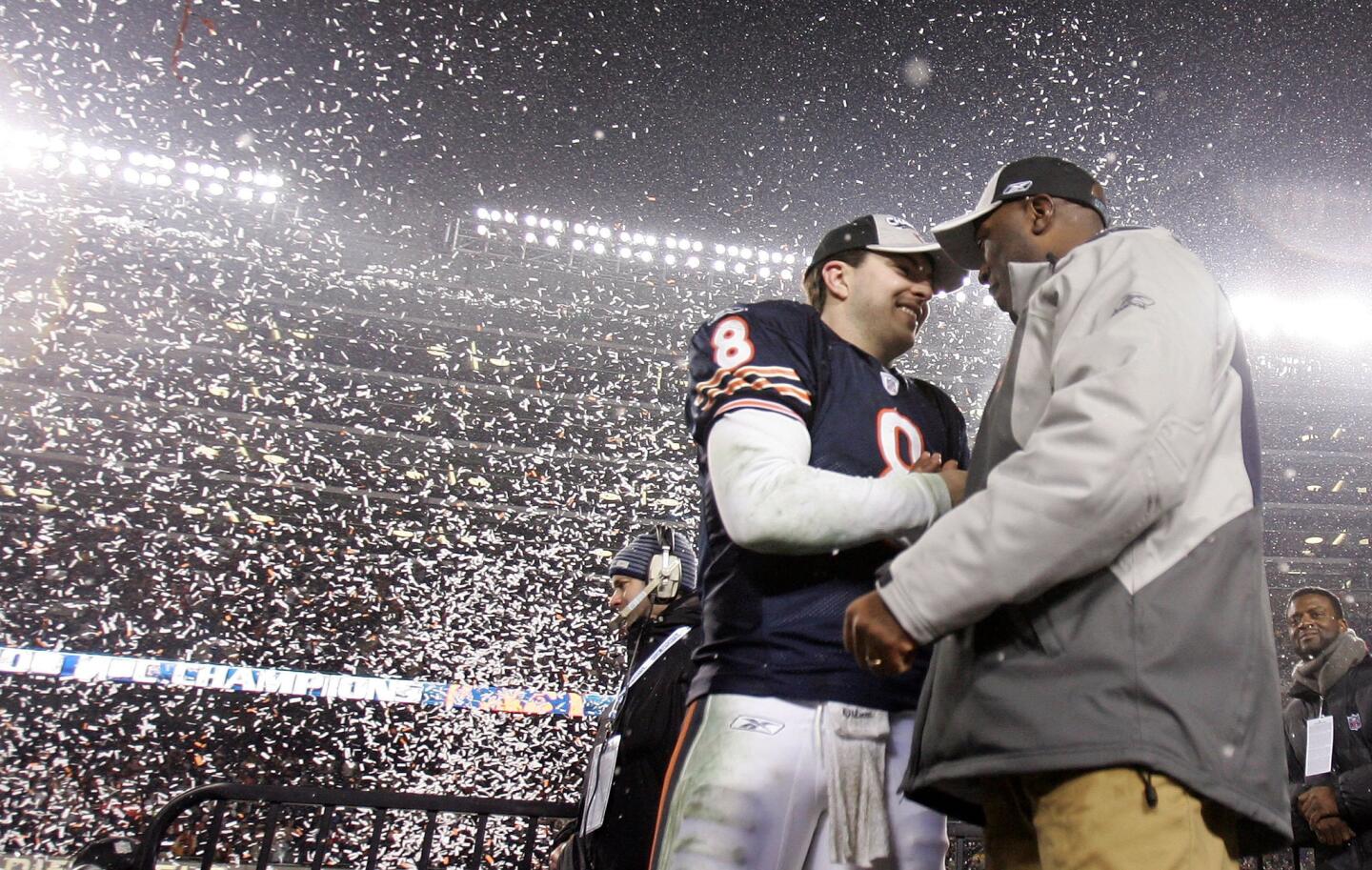 Quarterback Rex Grossman and head coach Lovie Smith celebrate after the Bears 39-14 win against the Saints during the NFC Championship game at Soldier Field on January 21, 2007.