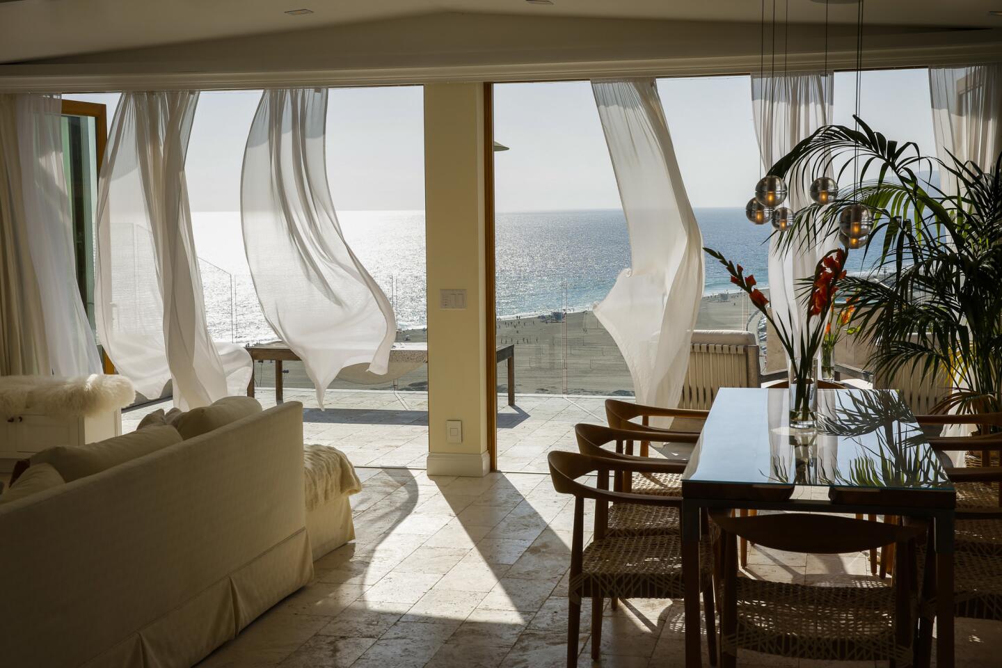 Sisters Tessa and Alyssa Hendrie transformed a rundown, double-wide trailer at the Point Dume Club in Malibu into a chic, four-bedroom beach house with stunning views of Zuma Beach. "We didn't want the interiors to distract from the view," says designer Tessa Hendrie.