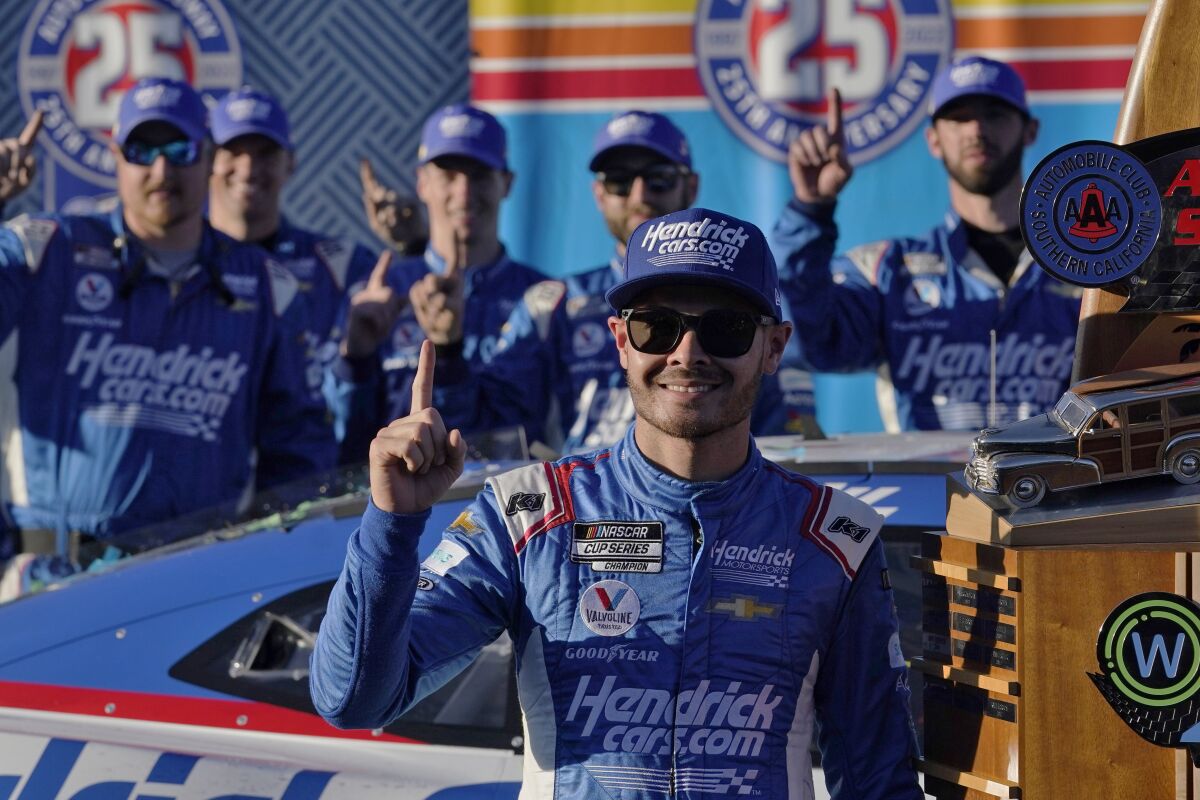 Kyle Larson celebrates after winning the NASCAR Cup Series auto race at Auto Club Speedway Sunday, Feb. 27, 2022, in Fontana, Calif. (AP Photo/Marcio Jose Sanchez)