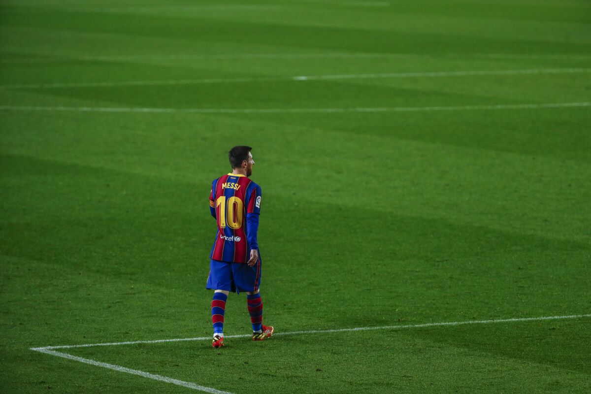 Barcelona's Lionel Messi walks on the field during a game against Huesca on March 15 at the Camp Nou stadium.