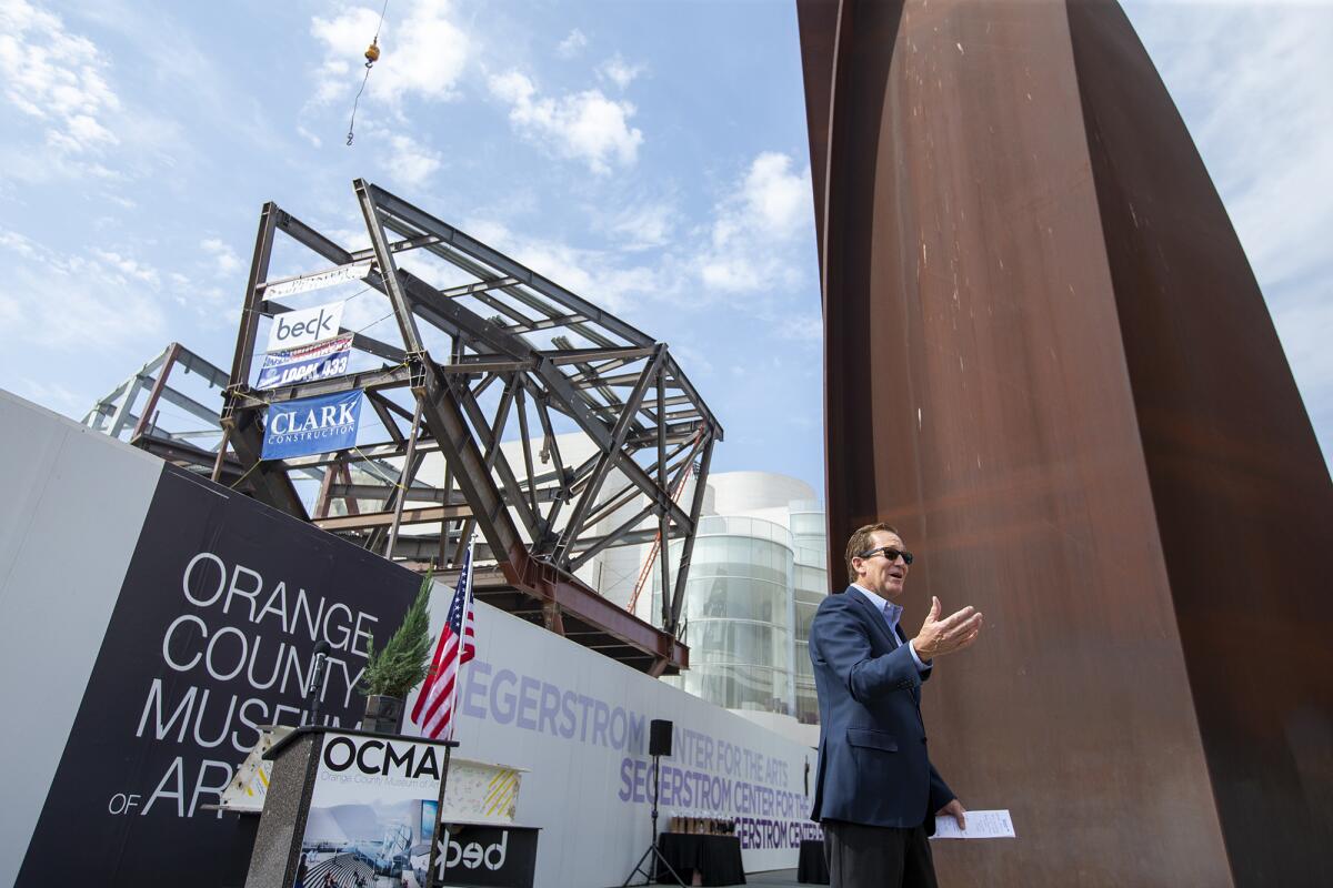 Mark Perry, the Chair of the Board of Directors for the Segerstrom Center for the Arts, speaks during a topping out ceremony.