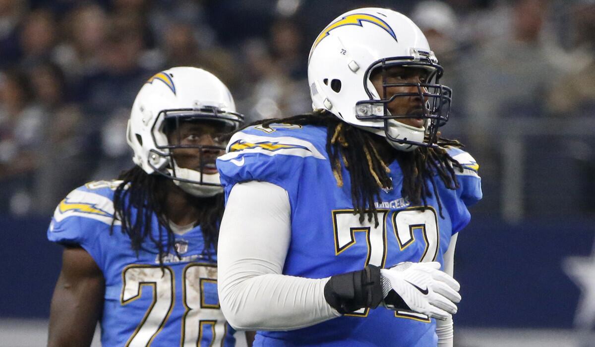 At 6-foot-5 and 325 pounds, Chargers offensive tackle Joe Barksdale (72) dwarfs teammate Melvin Gordon. But his size and athletic ability haven't made him immune to an affliction that dates to his childhood: depression.