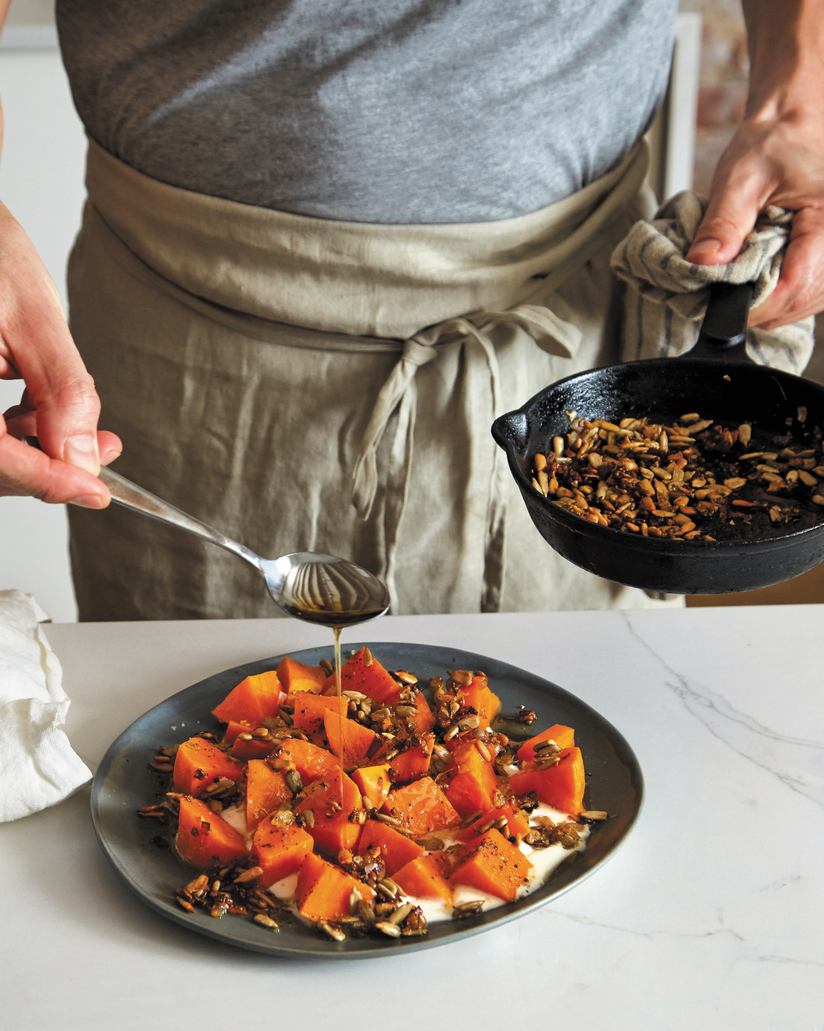 Spiced sunflower seeds and caramelized onions add punch to chilled chunks of precooked sweet potatoes in this dish from "Start Simple" by Lukas Volger.