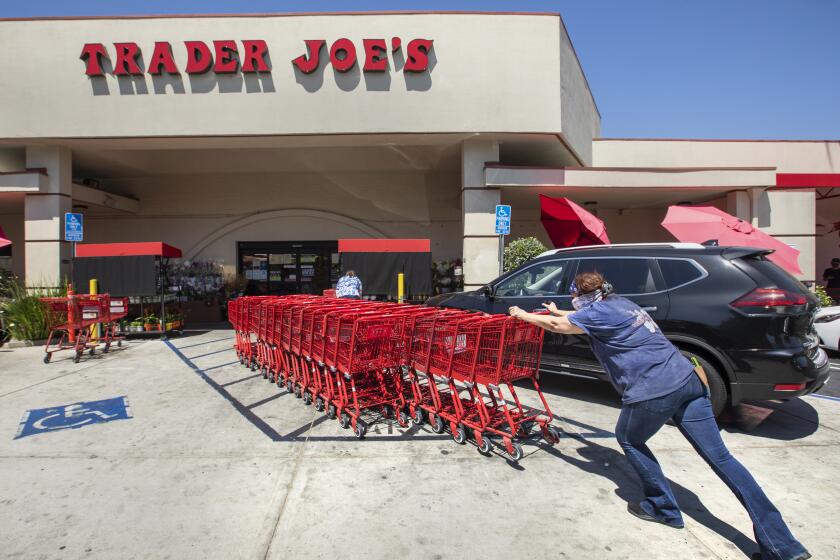 SHERMAN OAKS, CA -JULY 20, 2020: Shopping carts are returned to a collection area outside of Trader Joe's on Riverside Dr. In Sherman Oaks. Trader Joe's has responded to criticisms about its packaging by announcing that it is in the process of eliminating labels that use ethnic-sounding names intended to be humorous. The offending products bear such labels as Trader Ming's for foods and condiments related to Chinese cuisine, Trader Jose's for Mexican-style products and Trader Giotto's for Italian-themed items. (Mel Melcon / Los Angeles Times)