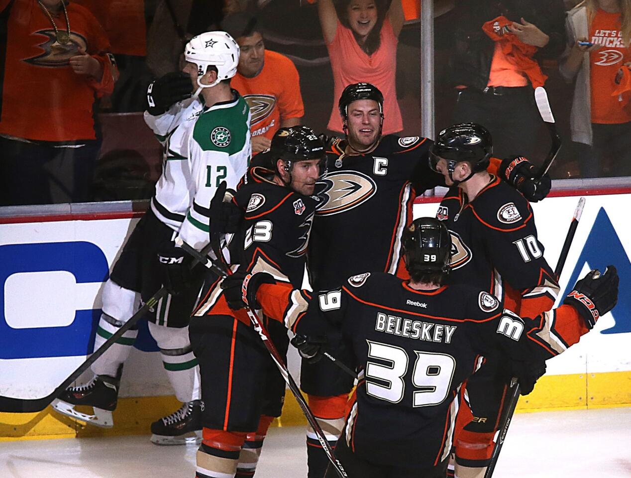 The Ducks celebrate following a goal by captain Ryan Getzlaf, top center, during the first period of Game 1 of the Western Conference quarterfinals against the Dallas Stars at Honda Center.