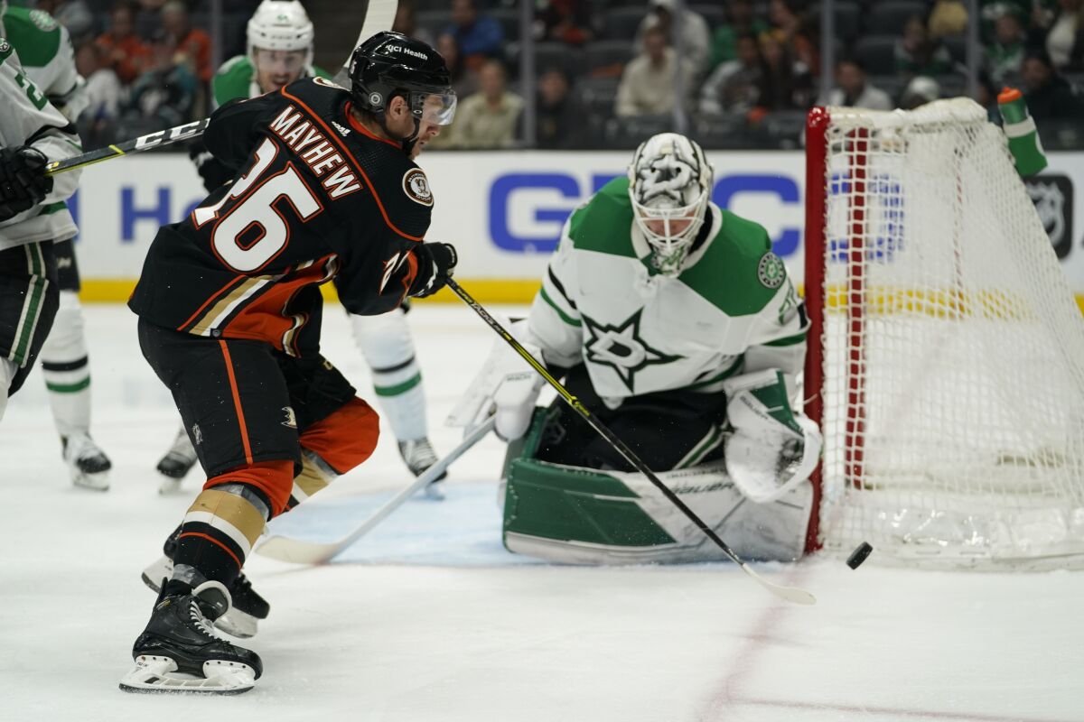 Ducks forward Gerry Mayhew shoots against Dallas Stars goaltender Jake Oettinger.
