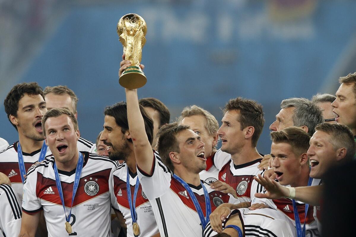 Germany captain Philipp Lahm holds the World Cup trophy after his country's 1-0 victory over Argentina in the final.