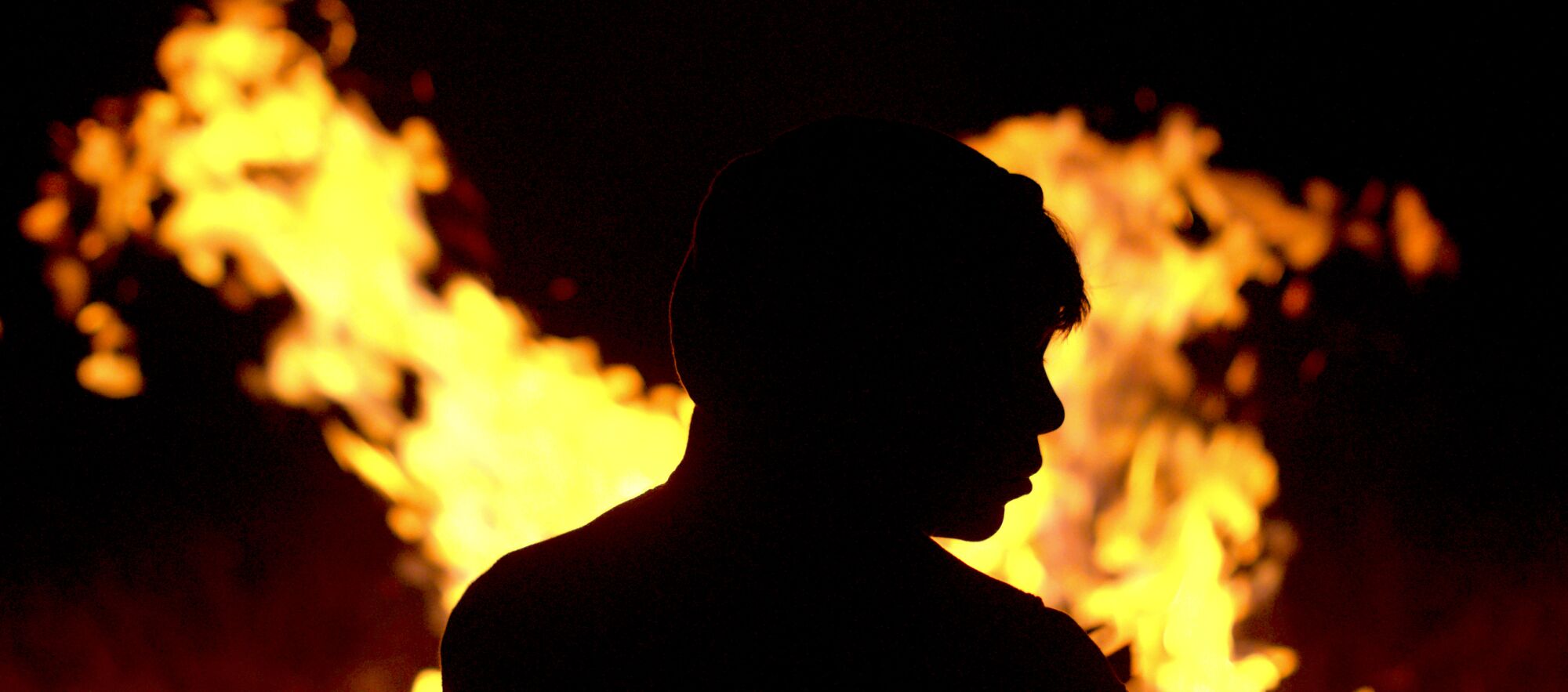 Juan Jesús Varela is silhouetted by flames in a scene from "Identifying Features."