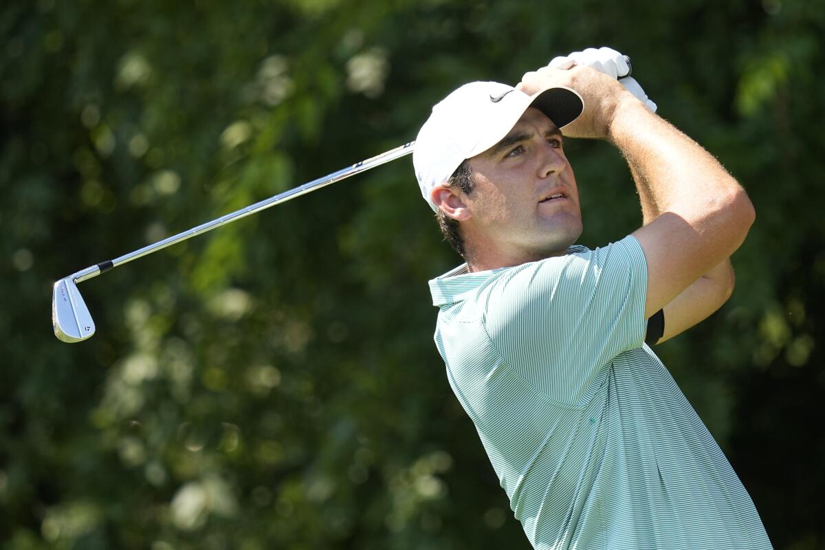 Scottie Scheffler watches his tee shot on No. 2 at the Tour Championship on Aug. 27, 2022.