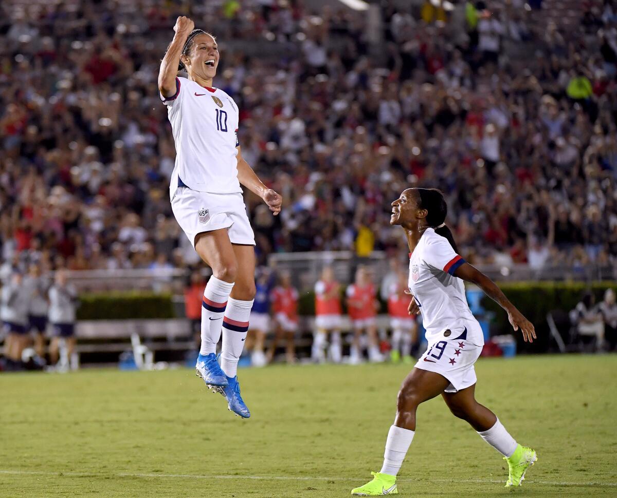 PASADENA, CALIFORNIA - AUGUST 03: Carli Lloyd #10 of the United States celebrates her goal with Crystal Dunn #19, to take a 3-0 lead over the Republic of Ireland, during the first half of the first game of the USWNT Victory Tour at Rose Bowl on August 03, 2019 in Pasadena, California. (Photo by Harry How/Getty Images) ** OUTS - ELSENT, FPG, CM - OUTS * NM, PH, VA if sourced by CT, LA or MoD **