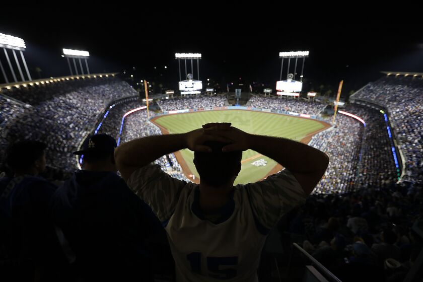 LOS ANGELES, CALIF. --WEDNESDAY, NOV. 1, 2017: A Dodgers fan shows his frustration in the fifth inning as the Houston Astros went on to beat the Dodgers 5-1 in Game 7 to win their first World Series at Dodger Stadium Wednesday, Nov. 1, 2017. (Allen J. Schaben / Los Angeles Times)