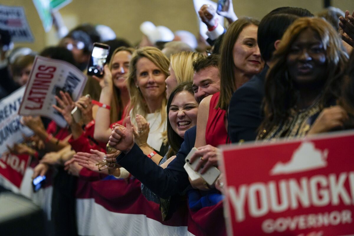 Supporters of Republican gubernatorial candidate Glenn Youngkin gather for an election night party in Chantilly, Va.,Tuesday , Nov. 2, 2021. (AP Photo/Andrew Harnik)