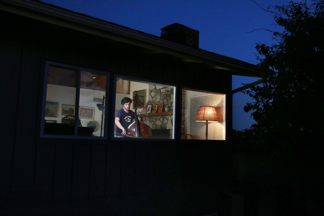 Weston Kerekes practices on his bass at home