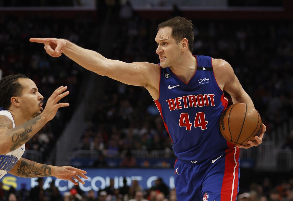 Detroit Pistons forward Bojan Bogdanovic tackles a teammate during a game against the Orlando Magic on December 28.