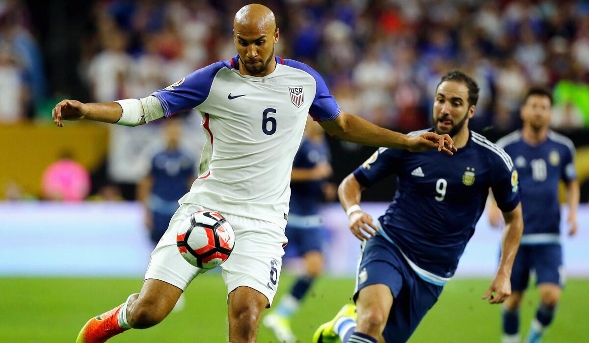 USA's John Brooks, left, handles the ball against Argentina's Gonzalo Higuain in the second half during a Copa America Centenario semifinal match on Tuesday.