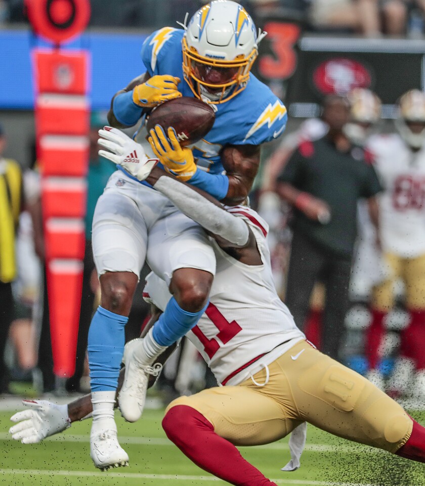 Chargers cornerback Asante Samuel Jr. (26) intercepts a pass intended for 49ers receiver Brandon Aiyuk (11)