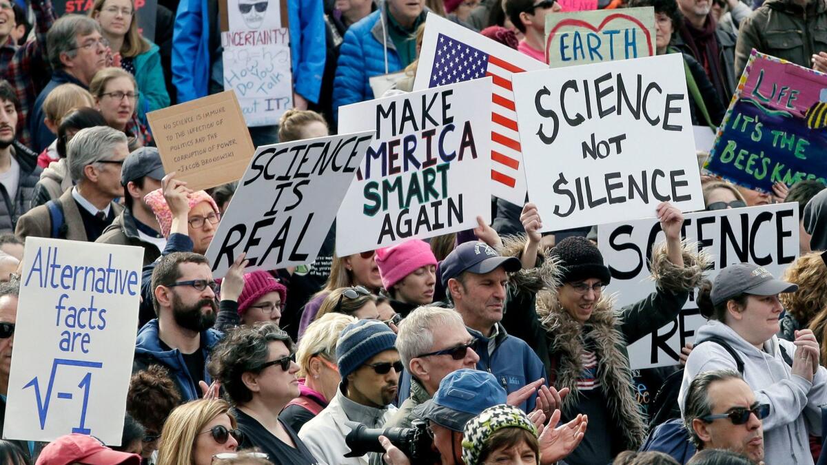 Members of the scientific community and their supporters at a rally in Boston at February. The American College of Physicians is urging its members to participate in the March for Science on Saturday.