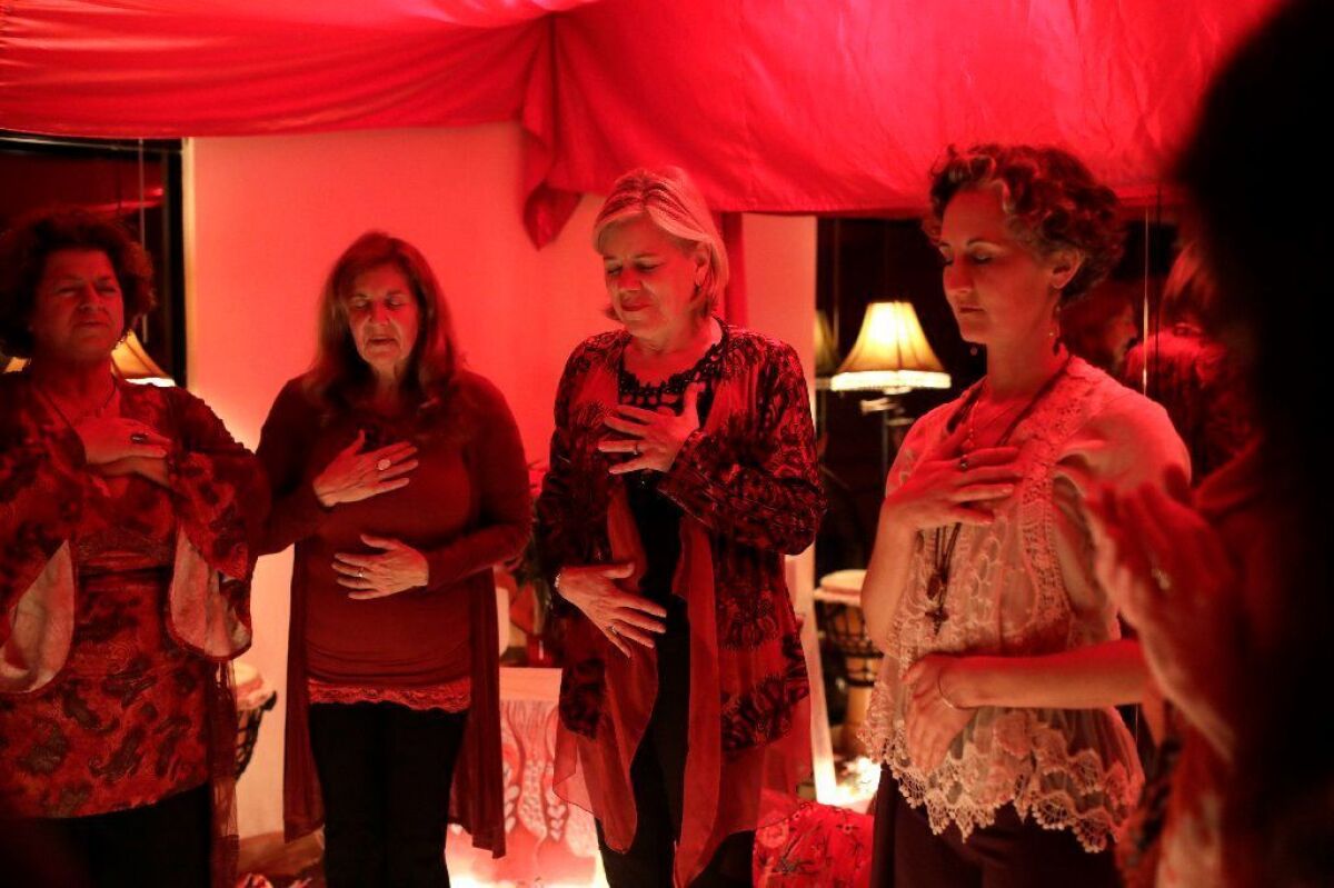 From left, Rina Daly-Goode, Leah Zahner, Greta Hassel and Mia Leighty. "“For anyone who has never been here, the Red Tent is a sacred space set aside for us to remember,” Hassel, the evening's host, told the other participants.