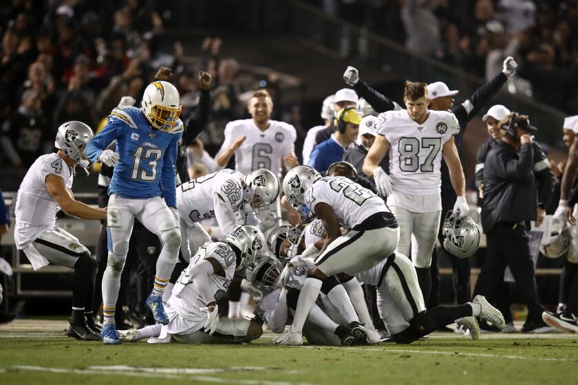 OAKLAND, CALIFORNIA - NOVEMBER 07: Karl Joseph #42 of the Oakland Raiders is surrounded by teammates after he intercepted a pass late in the fourth quarter against the Los Angeles Chargers at RingCentral Coliseum on November 07, 2019 in Oakland, California. (Photo by Ezra Shaw/Getty Images)