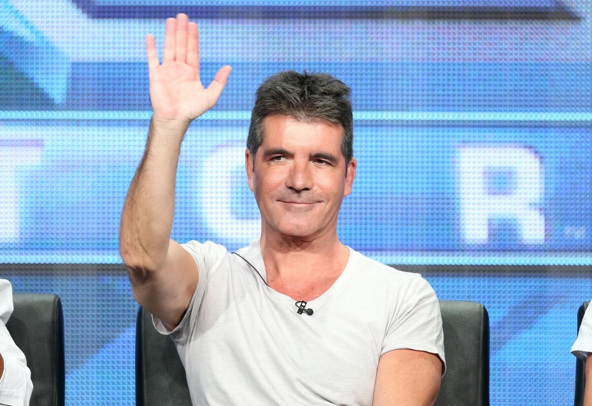 Simon Cowell speaks during the "The X Factor" panel discussion at the 2013 Summer Television Critics Assn. tour in Beverly Hills.