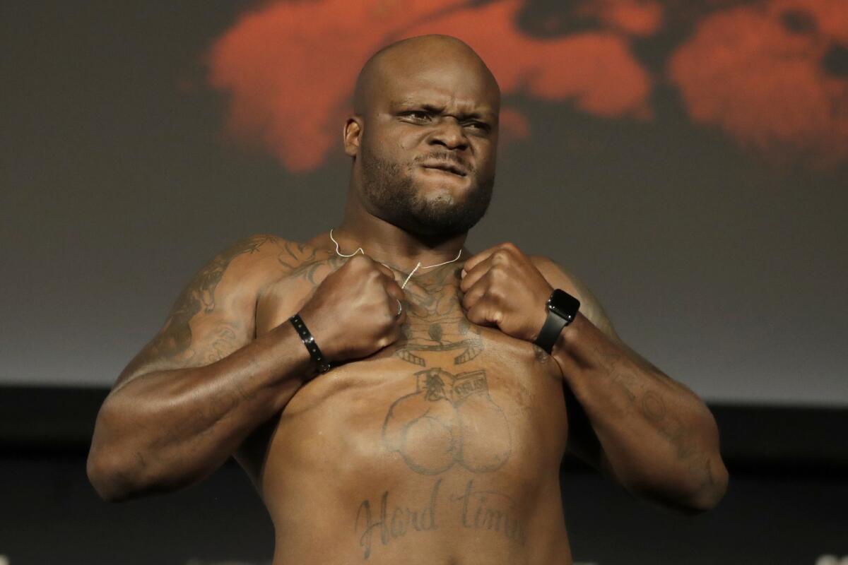 Derrick Lewis thumps his chest after the weigh-in for UFC 230.