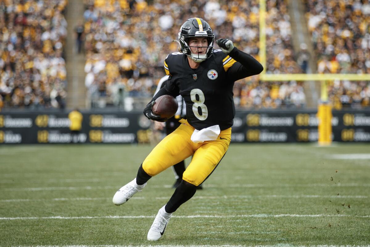 Pittsburgh Steelers quarterback Kenny Pickett scrambles for a touchdown.