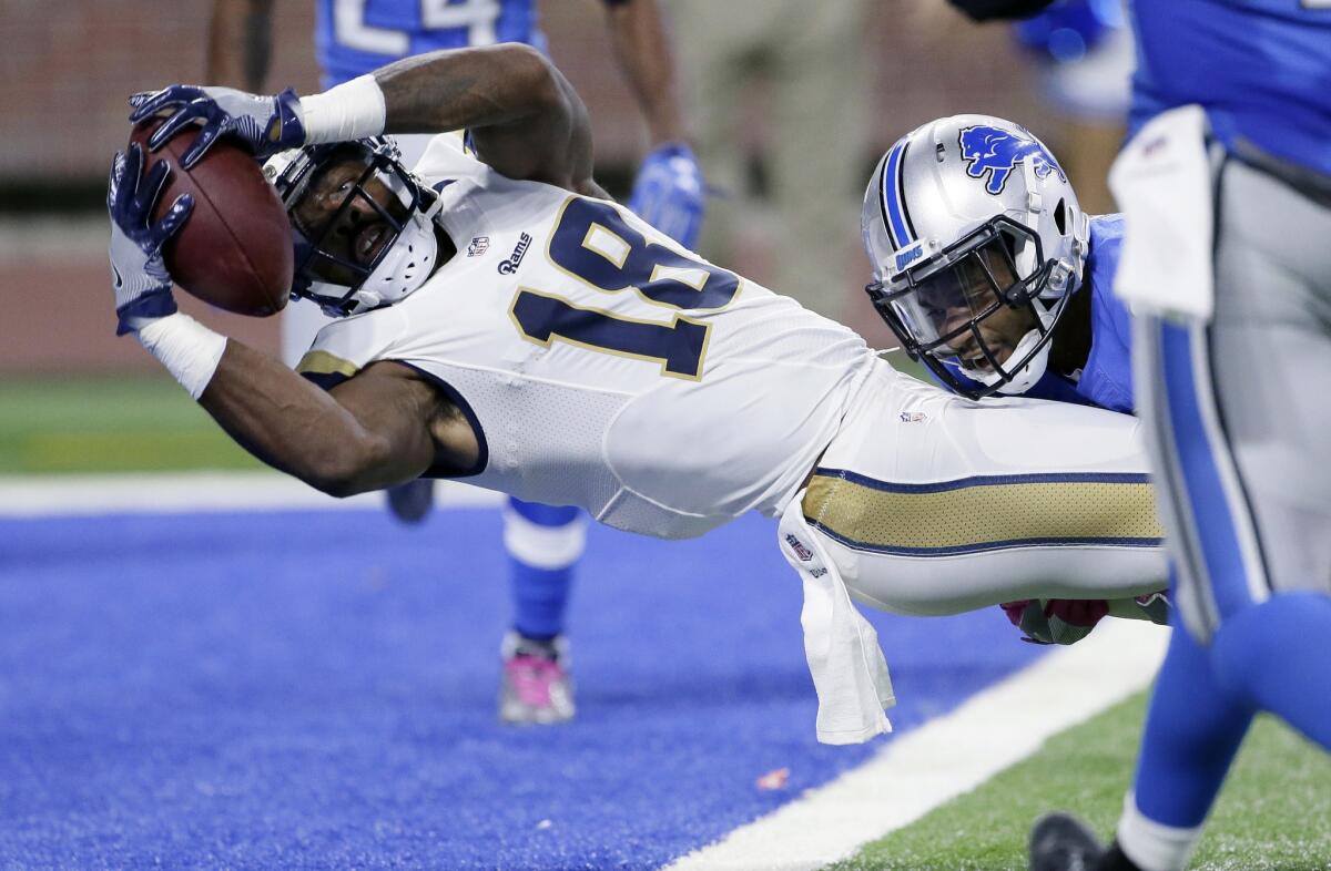 Rams wide receiver Kenny Britt powers his way into the end zone while being tackled by Detroit free safety Glover Quinduring during the first half of Sunday's game.
