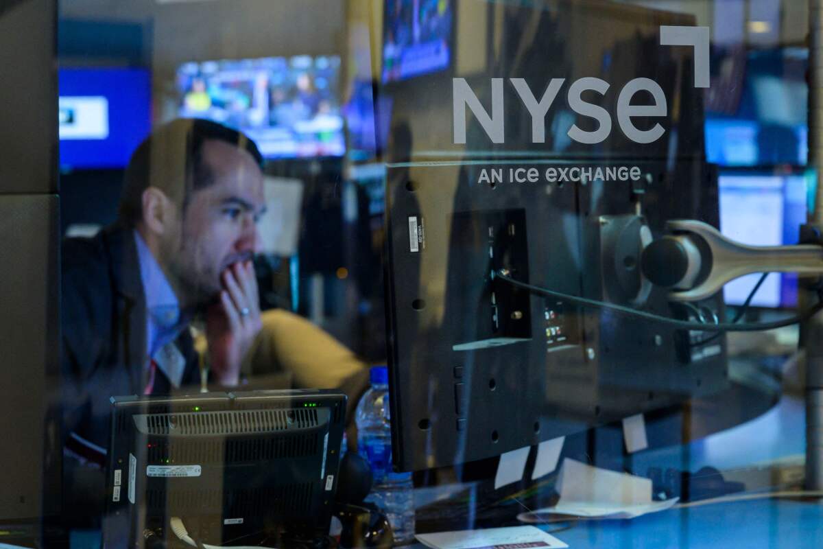 A trader works during the opening bell at the New York Stock Exchange