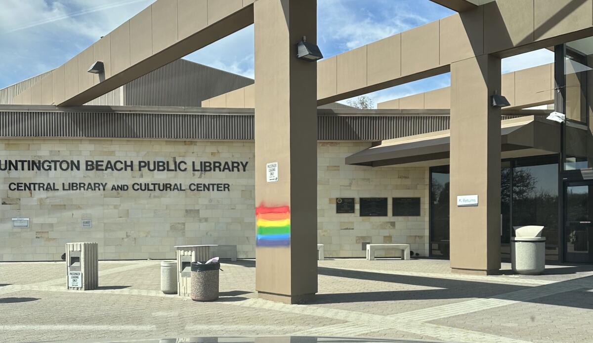 A Pride flag was found spray-painted on a post at the Huntington Beach Central Library on Sunday.